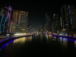 a river running through a city at night