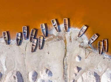 Exploring The Top Reasons To Travel To Senegal 3 boats dock on sand
