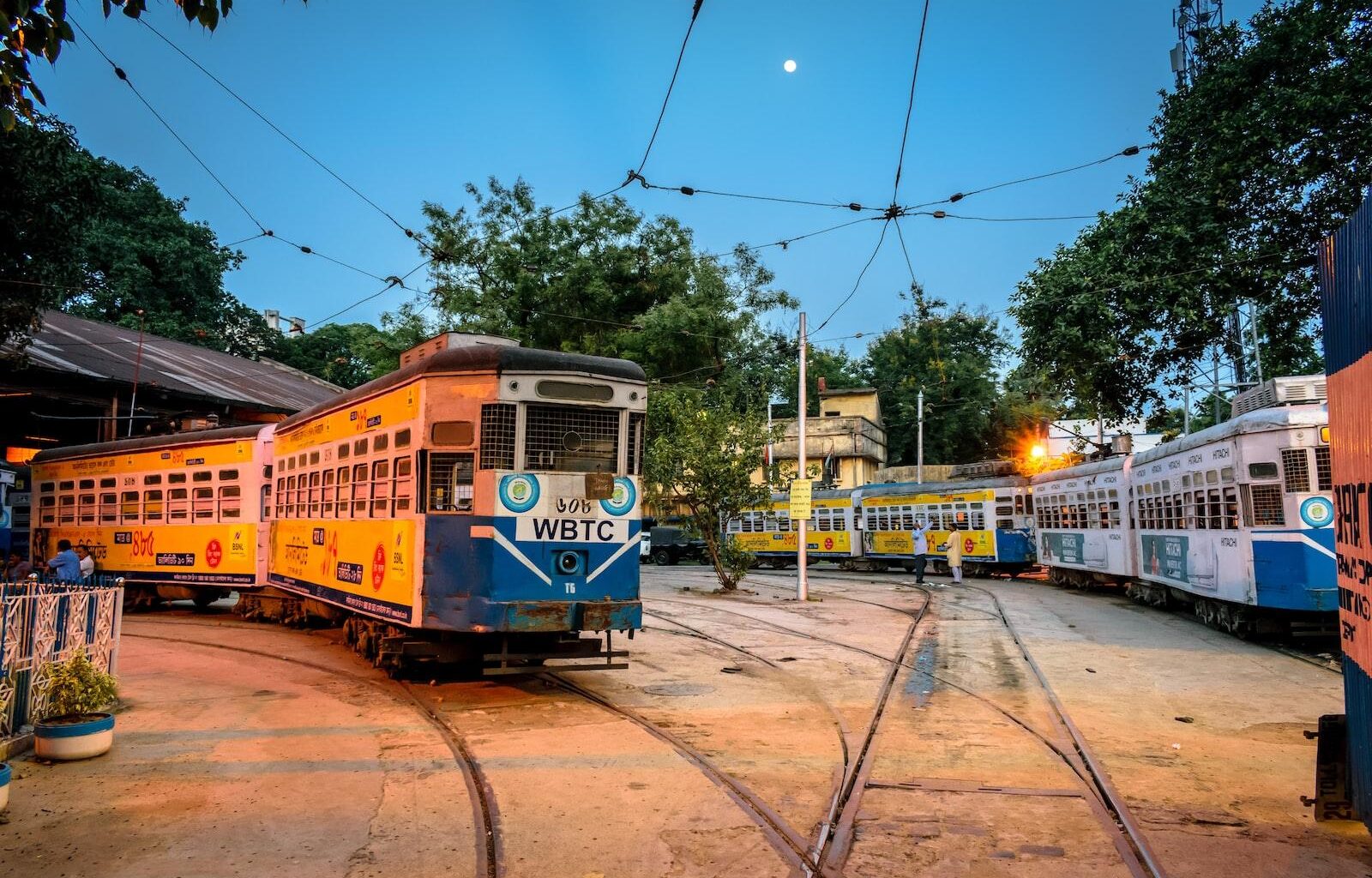 yellow and white tram on road during daytime