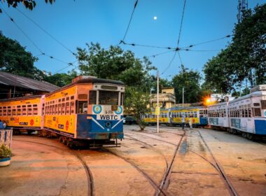 yellow and white tram on road during daytime