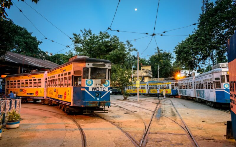 yellow and white tram on road during daytime