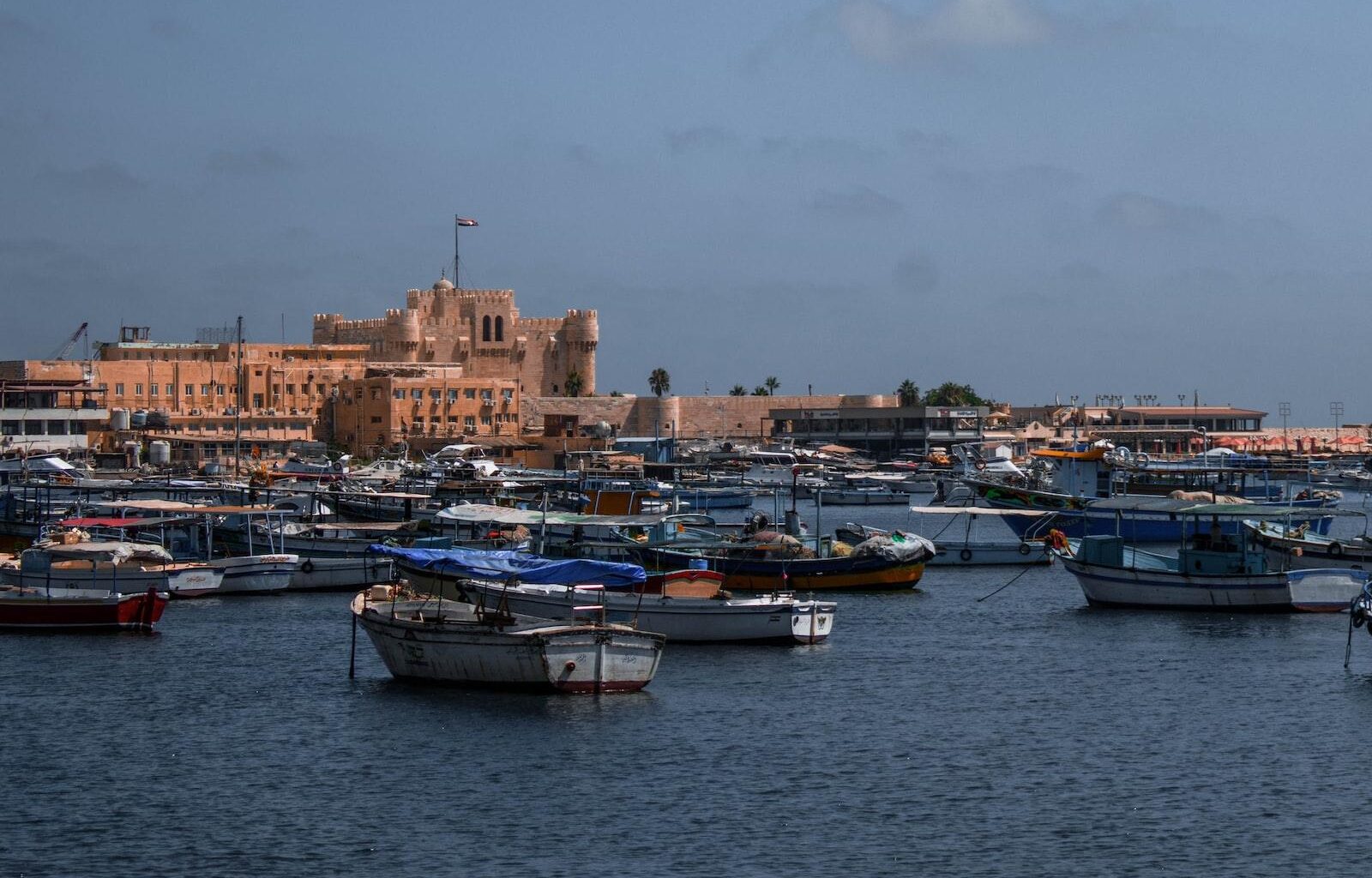 The Best Things To Do In Alexandria Egypt 1 white and blue boat on water near city buildings during daytime