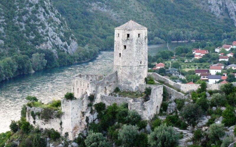 Aerial Picture of Gray Stone Tower Beside River and Town