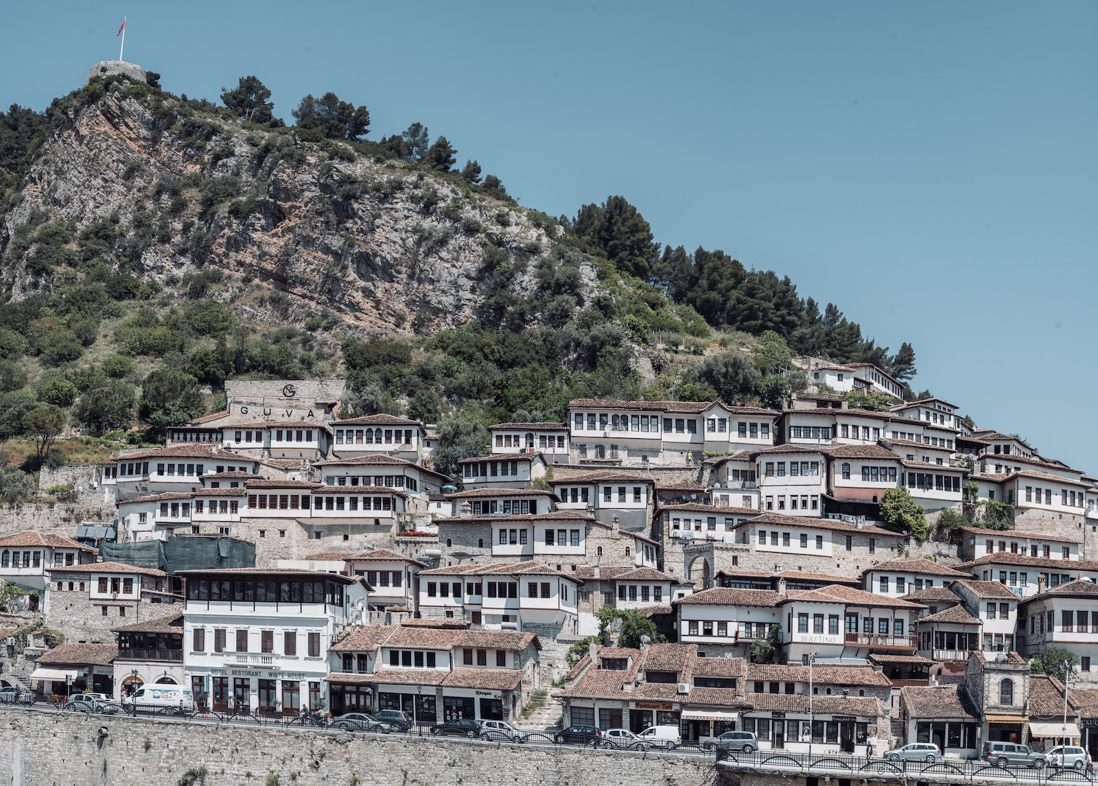 White Buildings with Roof Tile on a Rocky Mountainside