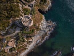 Aerial view of medieval fortress on green seashore