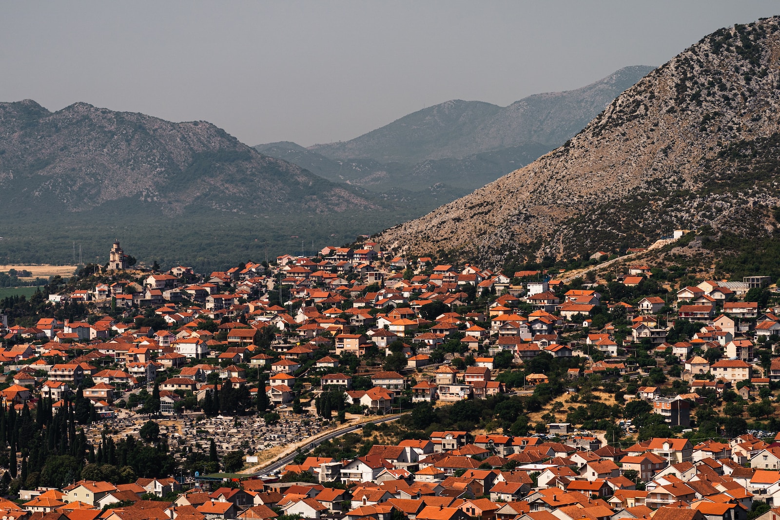 a city with a mountain in the background