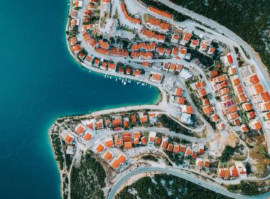 an aerial view of a city by the water