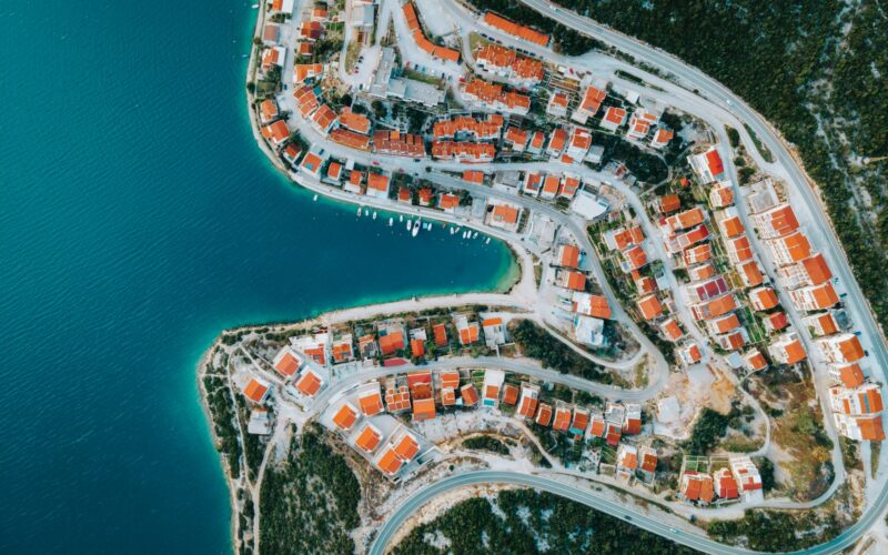 an aerial view of a city by the water