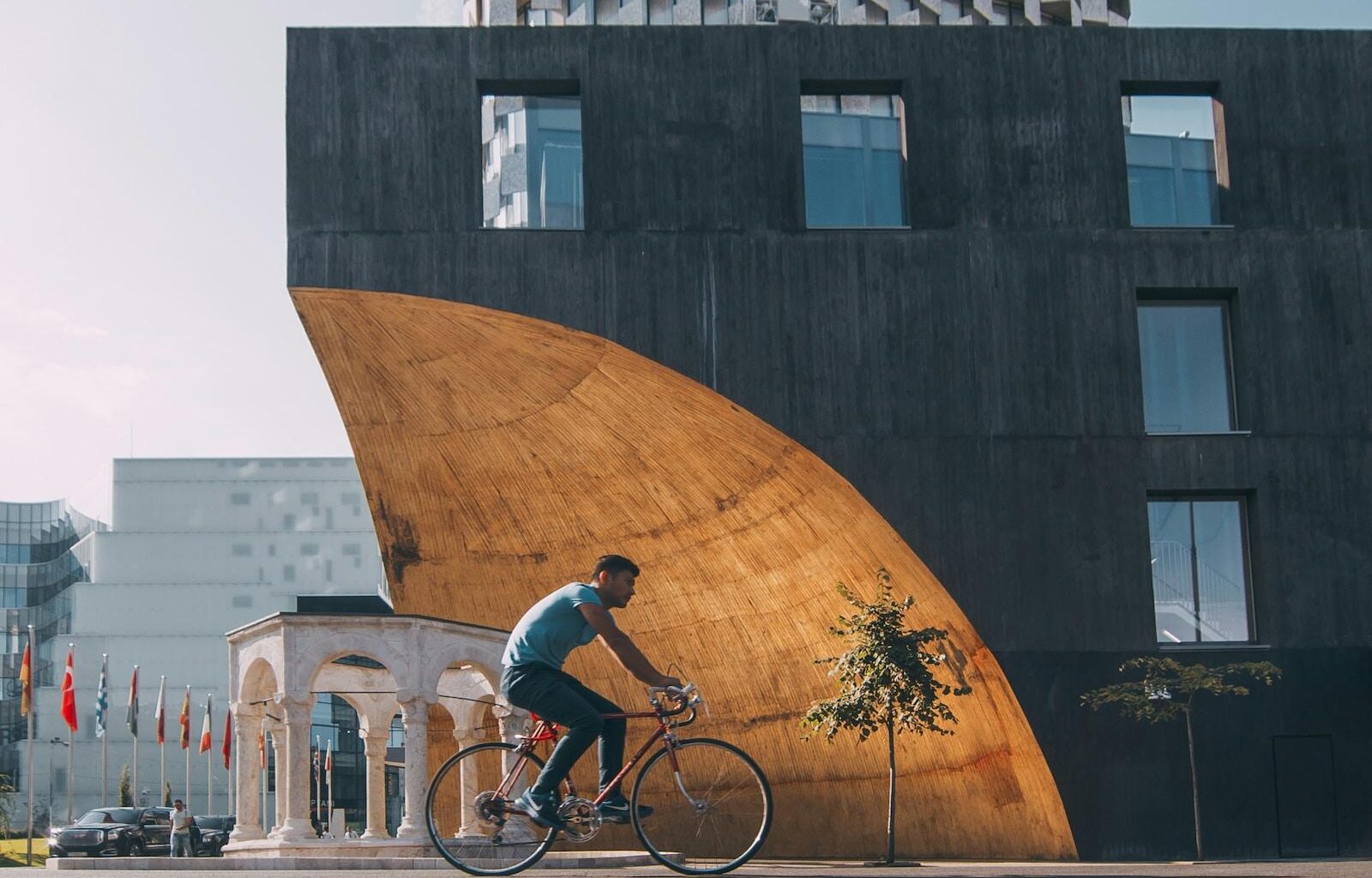 man riding bicycle near building