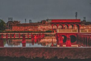red concrete building near body of water during daytime
